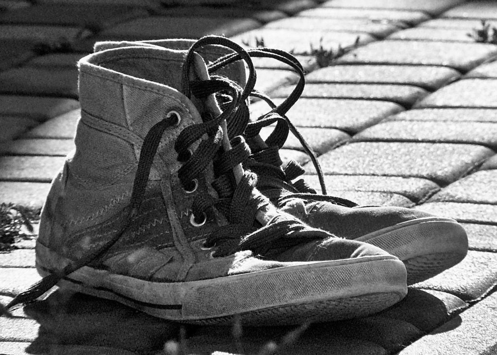 Worn-out sneakers waiting to be recycled