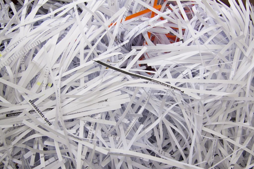 A bin filled with shredded paper for recycling